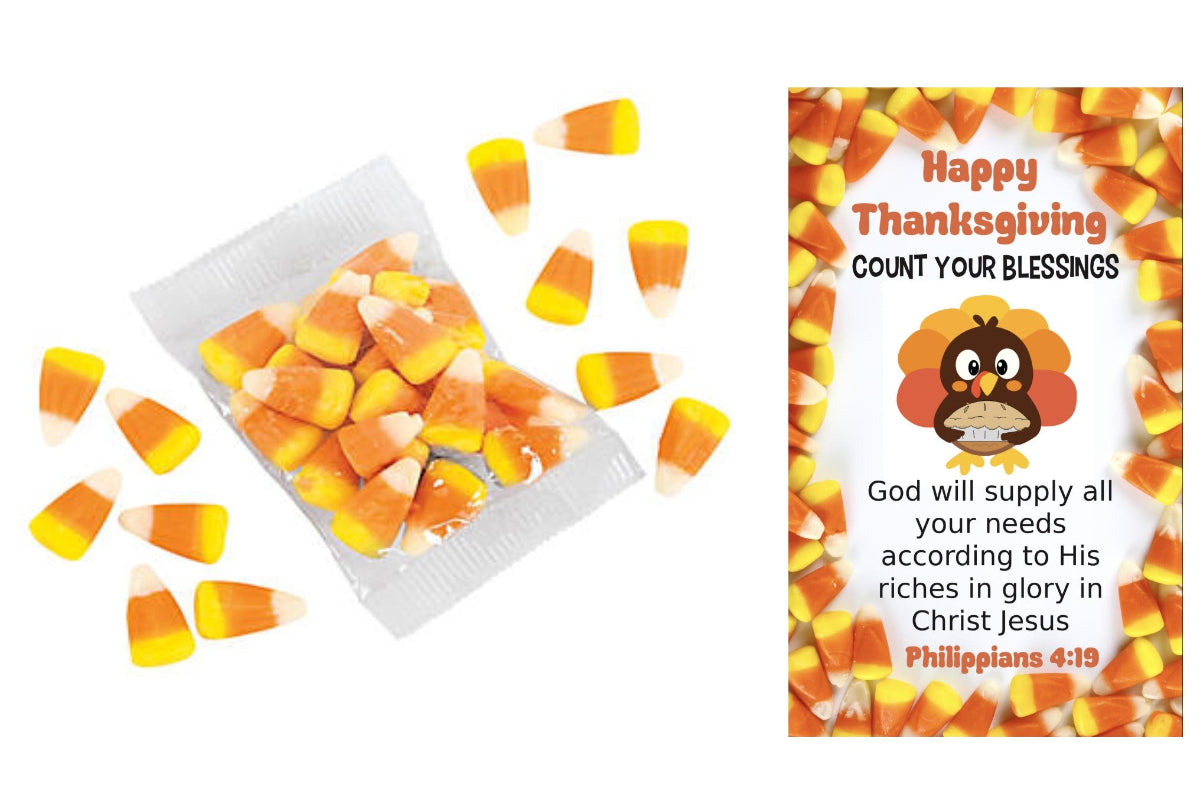 A clear bag filled with candy corn pieces on a white background, surrounded by scattered candy corn pieces. To the right is a printed Thanksgiving-themed card or insert with candy corn border, a turkey illustration, and the text 'Happy Thanksgiving COUNT YOUR BLESSINGS' plus a Bible verse.