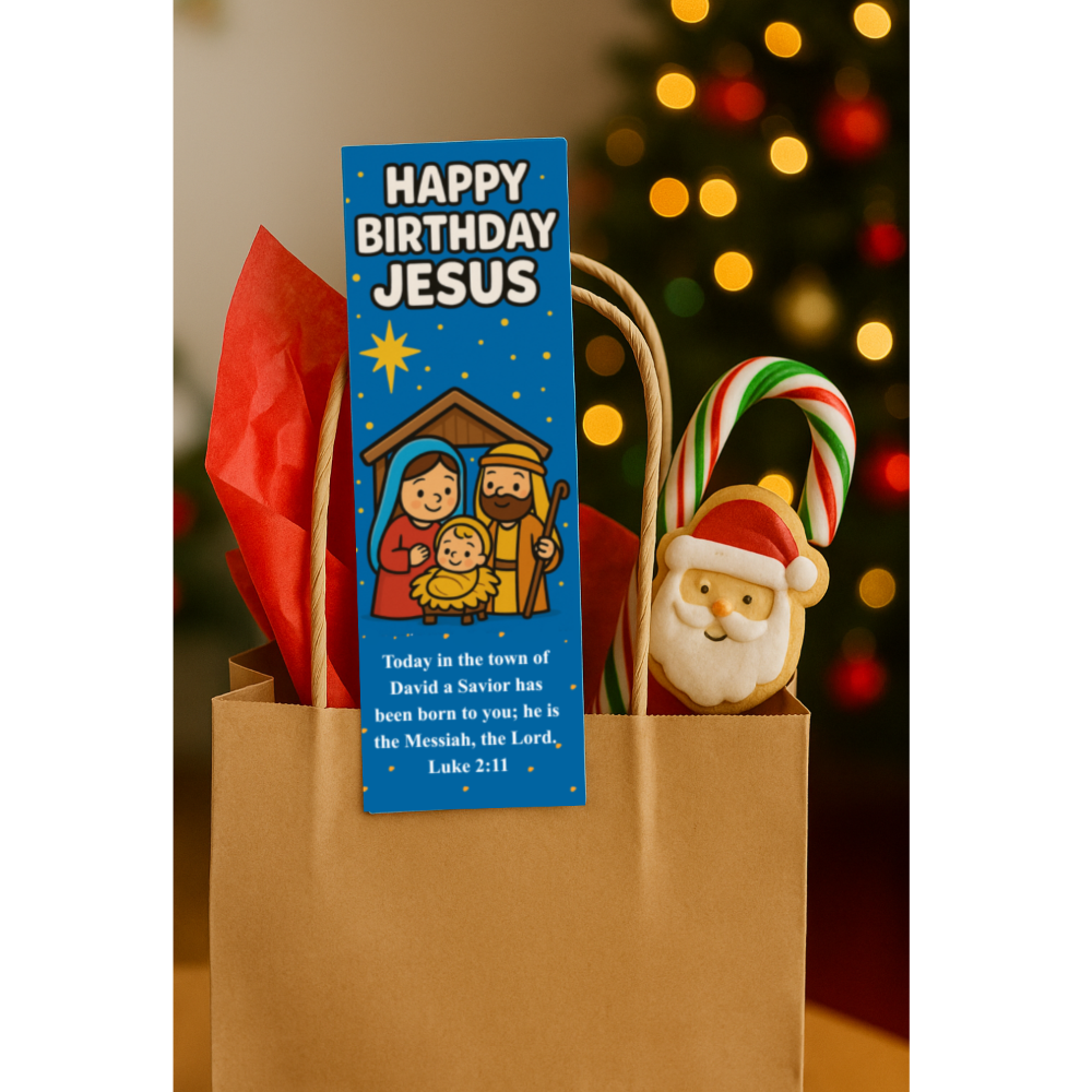 Card with nativity scene and 'Happy Birthday Jesus' text in a gift bag with candy canes and Santa Claus figurine, Christmas tree in the background.