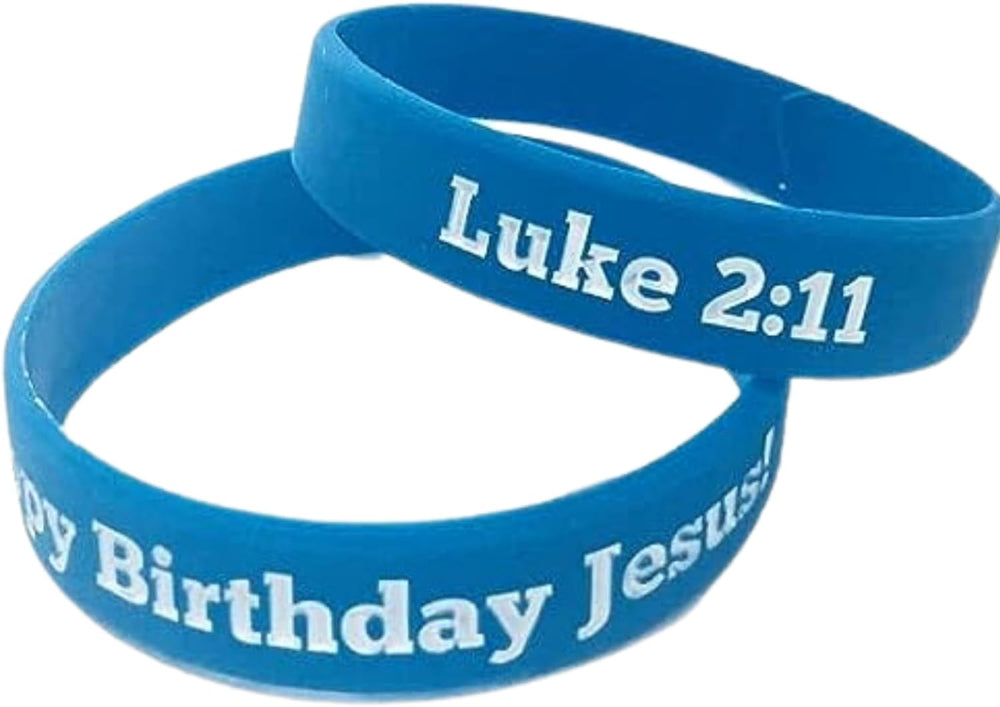 Two blue silicone wristbands with white text, one displaying 'Happy Birthday Jesus' and the other 'Luke 2:11'.