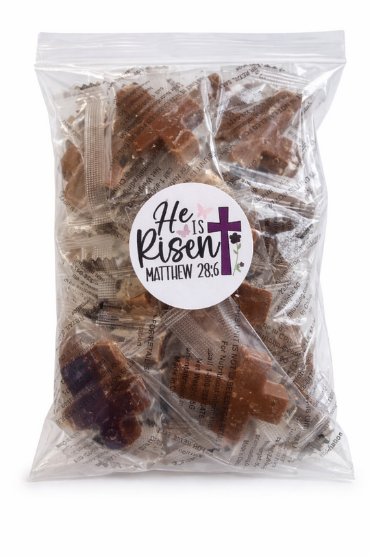 Packaged brown candy with a 'He is Risen' label on a white background