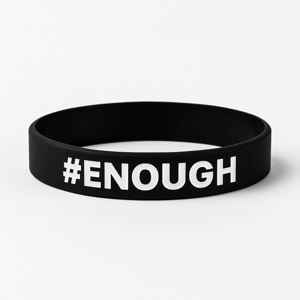 Black wristband with '#ENOUGH' text on a white background