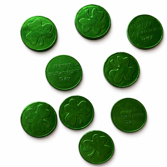 Green milk chocolate coins with shamrock designs and 'Happy St. Patrick's Day' text on a white background