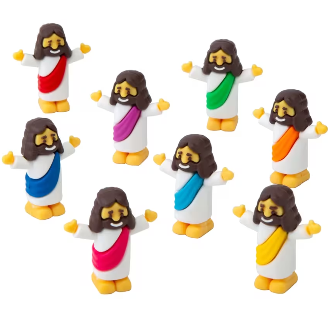 Figurines of a Jesus character with brown hair and colorful robes on a white background
