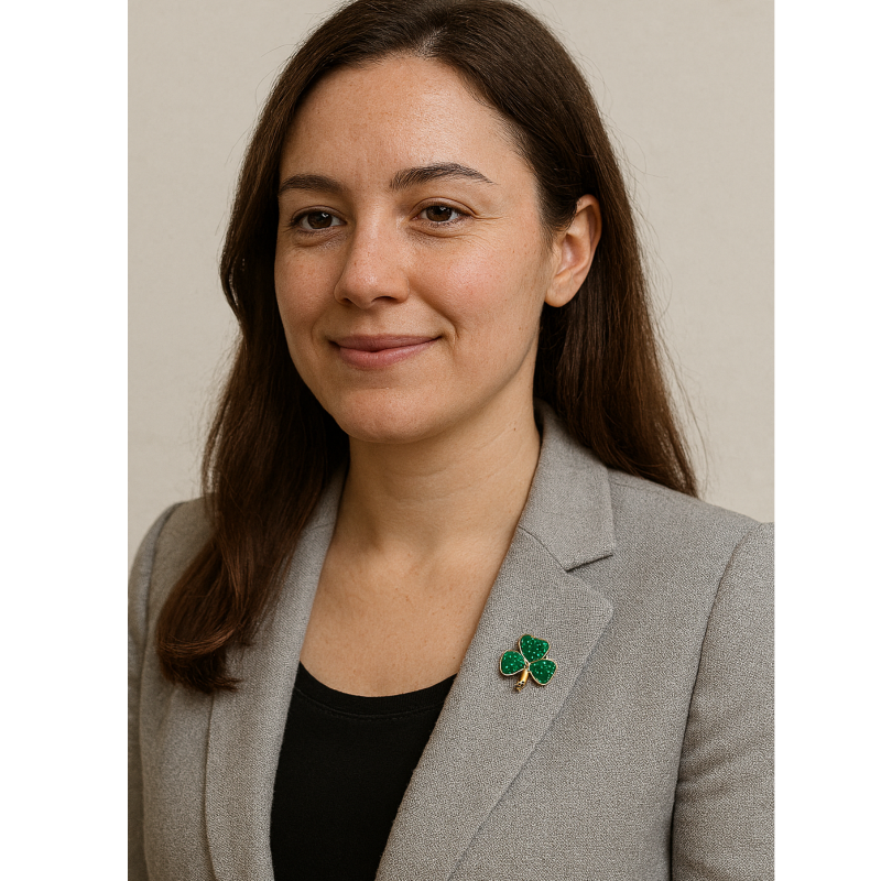 woman wearing a shamrock pin
