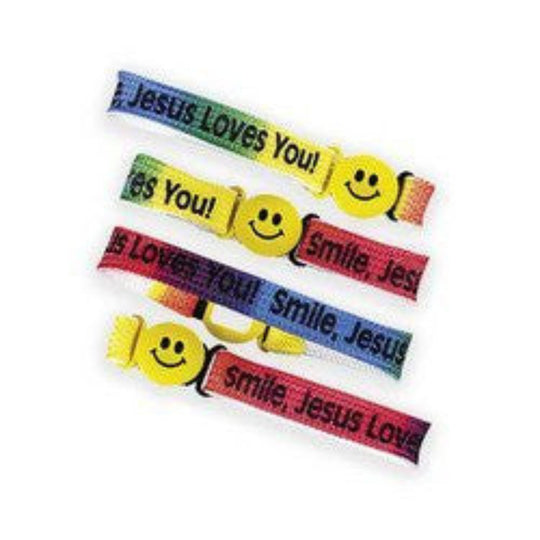 A series of colorful nylon friendship bracelets with the text 'JESUS LOVES YOU' and smiley faces on them.