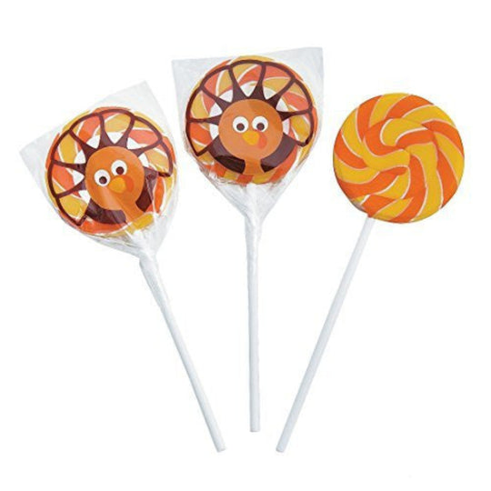 A set of three turkey-shaped suckers with orange, yellow, and red colors, mounted on white plastic sticks.