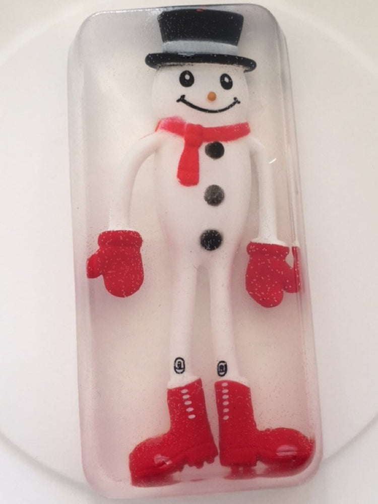 A bar of soap shaped like a frosty snowman with a white body, red hat and mittens, and a smiling face, packaged in clear plastic.